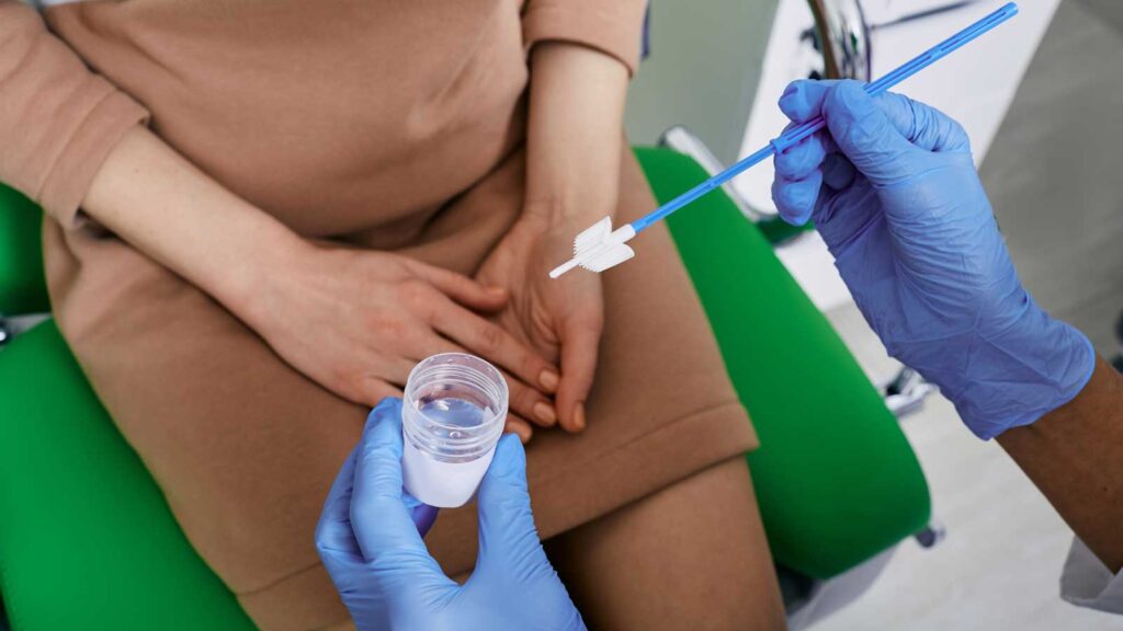 Healthcare provider preparing for a Pap smear test to check cervical health.