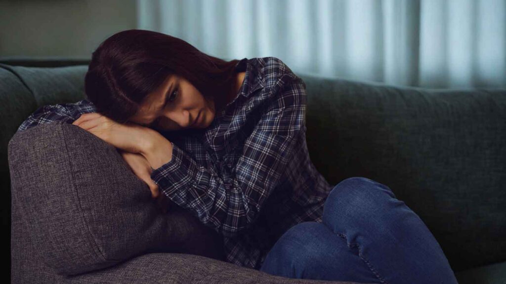 Woman feeling emotional while dealing with fibroids and fertility concerns 