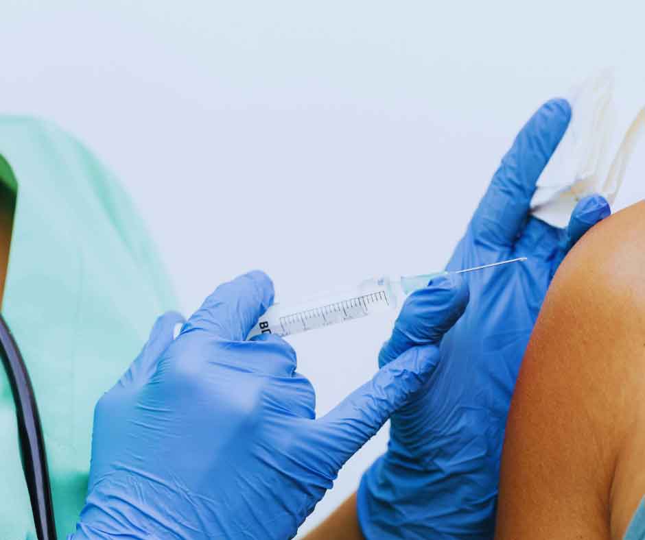 Hormone replacement therapy shot being prepared by medical professional 